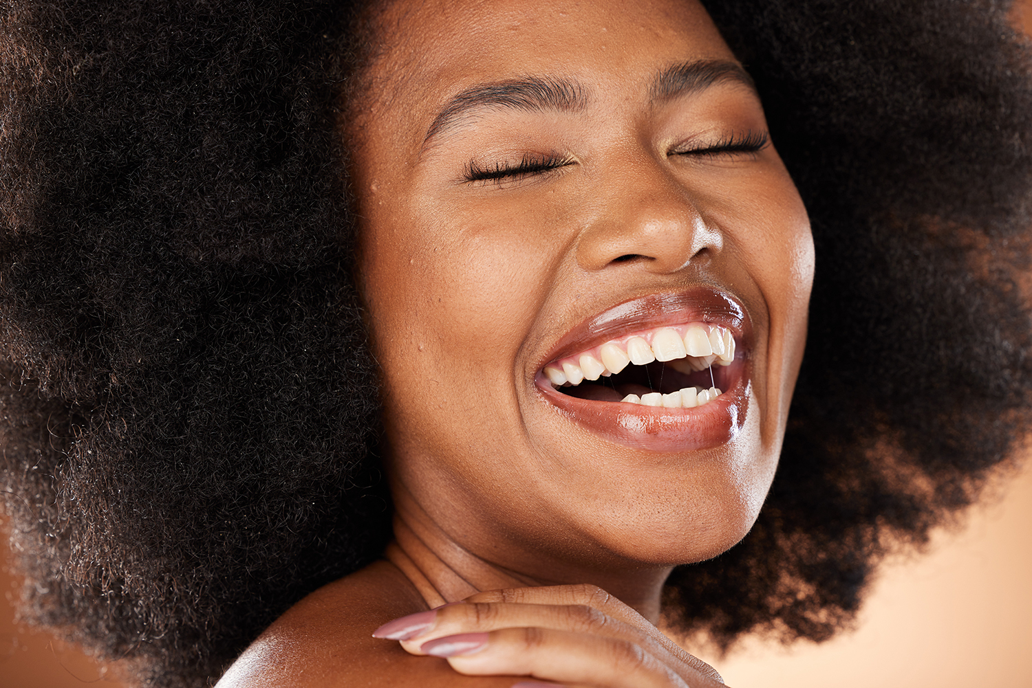 Laughing Black woman with Beautiful white teeth