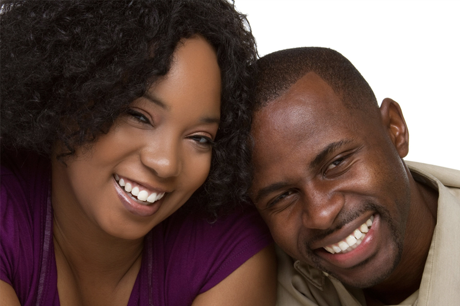 Young african american couple with beautiful, white smiles